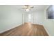 Bedroom featuring neutral walls, hardwood floors, a ceiling fan, and a closet at 115 Leland Se St, Port Charlotte, FL 33952
