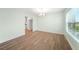 Dining room features new flooring, a view of the kitchen and bright light from the window at 115 Leland Se St, Port Charlotte, FL 33952