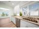 Updated kitchen with granite countertops and stainless steel appliances at 115 Leland Se St, Port Charlotte, FL 33952