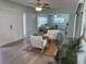 Bright, airy living room featuring neutral furniture and an open layout, creating a cozy and inviting atmosphere at 115 Leland Se St, Port Charlotte, FL 33952