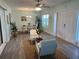 Inviting living room with neutral tones, stylish furniture, and a dining area for a comfortable living space at 115 Leland Se St, Port Charlotte, FL 33952