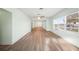 Spacious living room with new hardwood flooring, ceiling fans, and sun-filled windows at 115 Leland Se St, Port Charlotte, FL 33952