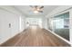 Spacious living room with new flooring, white trim, and lots of natural light at 115 Leland Se St, Port Charlotte, FL 33952