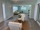 Relaxing living area with comfortable seating and neutral decor, providing a welcoming and spacious atmosphere at 115 Leland Se St, Port Charlotte, FL 33952