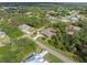 Wide aerial view of home and neighborhood at 1160 Rizzo St, Port Charlotte, FL 33952