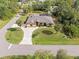 Aerial view of house, driveway, and street at 1160 Rizzo St, Port Charlotte, FL 33952