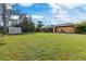 Large backyard with a shed and plenty of grassy area at 1160 Rizzo St, Port Charlotte, FL 33952