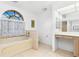 Main bathroom with bathtub, toilet and vanity at 1160 Rizzo St, Port Charlotte, FL 33952