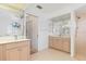 Main bathroom with dual sinks, a shower, and a toilet at 1160 Rizzo St, Port Charlotte, FL 33952