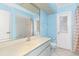 Updated bathroom with light blue walls, a single sink vanity, and a shower/tub combo at 1160 Rizzo St, Port Charlotte, FL 33952