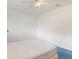 Simple bedroom with white walls, blue carpet, and a queen-size bed at 1160 Rizzo St, Port Charlotte, FL 33952