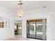 Bright dining room with sliding doors leading to the pool at 1160 Rizzo St, Port Charlotte, FL 33952