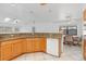 Kitchen boasts granite counters and wood cabinets at 1160 Rizzo St, Port Charlotte, FL 33952