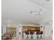 Open kitchen with breakfast bar and view into living area at 1160 Rizzo St, Port Charlotte, FL 33952