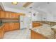 Modern kitchen with granite countertops and ample wood cabinets at 1160 Rizzo St, Port Charlotte, FL 33952