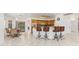 Kitchen boasts a breakfast bar and light wood cabinets at 1160 Rizzo St, Port Charlotte, FL 33952