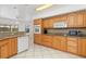 Well-equipped kitchen with ample cabinetry and granite countertops at 1160 Rizzo St, Port Charlotte, FL 33952