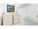 Laundry room with washer, dryer, and utility sink at 1160 Rizzo St, Port Charlotte, FL 33952