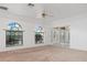 Living room with arched windows and entryway view at 1160 Rizzo St, Port Charlotte, FL 33952