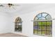 Spacious living room with large arched windows at 1160 Rizzo St, Port Charlotte, FL 33952