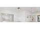 Spacious living room with mirrors and high ceilings at 1160 Rizzo St, Port Charlotte, FL 33952