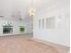 Large living room with neutral carpeting and natural light at 1160 Rizzo St, Port Charlotte, FL 33952