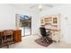 Home office with desk, chair and view of the pool and lanai at 1160 Rizzo St, Port Charlotte, FL 33952