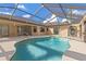 Inviting screened pool with a large patio and a view of the sky at 1160 Rizzo St, Port Charlotte, FL 33952
