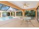 Relaxing screened pool area with patio furniture and a ceiling fan at 1160 Rizzo St, Port Charlotte, FL 33952