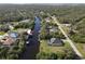 Aerial view showcasing a canal-front property in a residential area at 1228 Eppinger Dr, Port Charlotte, FL 33953