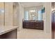 Elegant bathroom with double vanity, large mirror, and mosaic tile shower at 1228 Eppinger Dr, Port Charlotte, FL 33953