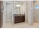 Elegant bathroom with dark brown vanity and a walk-in shower at 1228 Eppinger Dr, Port Charlotte, FL 33953