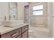 Clean bathroom with single vanity, tub, and shower at 1228 Eppinger Dr, Port Charlotte, FL 33953