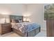 Cozy bedroom with queen bed, dark wood furniture, and neutral decor at 1228 Eppinger Dr, Port Charlotte, FL 33953
