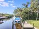 Private boat dock with lift for easy access to the water at 1228 Eppinger Dr, Port Charlotte, FL 33953