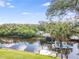 Scenic view of canal with lush greenery and boat at 1228 Eppinger Dr, Port Charlotte, FL 33953