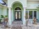 Elegant entryway with double doors, arched entry, and a small fountain at 1228 Eppinger Dr, Port Charlotte, FL 33953