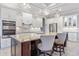 Gourmet kitchen with granite island, stainless steel appliances, and white cabinets at 1228 Eppinger Dr, Port Charlotte, FL 33953