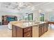 Spacious kitchen island with granite countertop and dark wood cabinets at 1228 Eppinger Dr, Port Charlotte, FL 33953