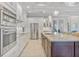Bright kitchen with granite countertops, stainless appliances & white cabinets at 1228 Eppinger Dr, Port Charlotte, FL 33953
