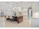 Open kitchen boasts a large island, stainless steel appliances, and white cabinetry at 1228 Eppinger Dr, Port Charlotte, FL 33953