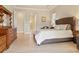 Main bedroom with a king bed and access to the bathroom at 1228 Eppinger Dr, Port Charlotte, FL 33953