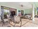 Spacious covered patio with outdoor kitchen, dining area, and seating at 1228 Eppinger Dr, Port Charlotte, FL 33953