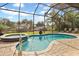 Relax in the screened-in pool and spa at 1228 Eppinger Dr, Port Charlotte, FL 33953