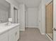 The bathroom features a glass shower, white cabinets, and a large mirror at 16031 Alcira Cir, Punta Gorda, FL 33955