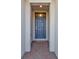 View of the house's front door with brick paved entrance and white pillars at 16031 Alcira Cir, Punta Gorda, FL 33955