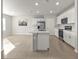 Modern kitchen with stainless steel appliances, a center island with a sink, and lots of counter space at 16031 Alcira Cir, Punta Gorda, FL 33955