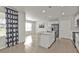 Bright kitchen features an island with stainless steel sink and modern appliances at 16031 Alcira Cir, Punta Gorda, FL 33955