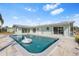 Relaxing backyard pool and patio area, perfect for outdoor entertaining and enjoying sunny days at 174 Severin Se Rd, Port Charlotte, FL 33952