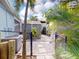 Backyard with shed, AC units, and stone pathway at 193 N Waterway Nw Dr, Port Charlotte, FL 33952